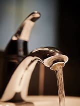 Faucet Running she turned the faucet on